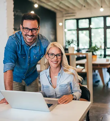 Husband and wife going over successful financial planning results from SL Capital.