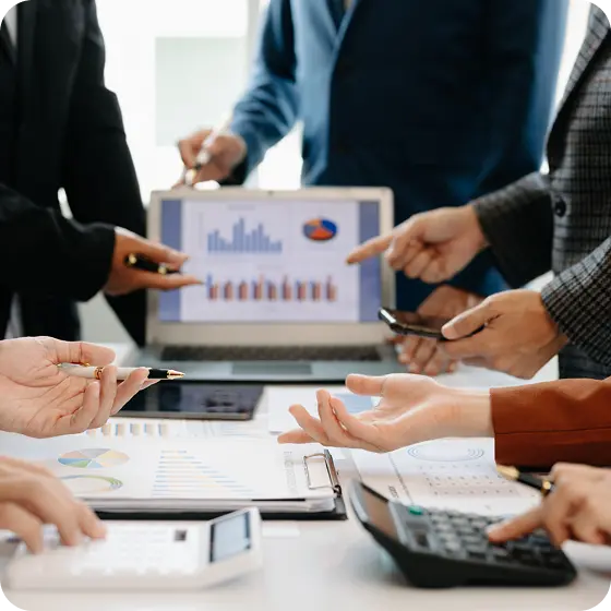 A financial services team examining customer market data to make decisions.