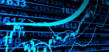 Financial data from SL Capital being examined on a computer screen.